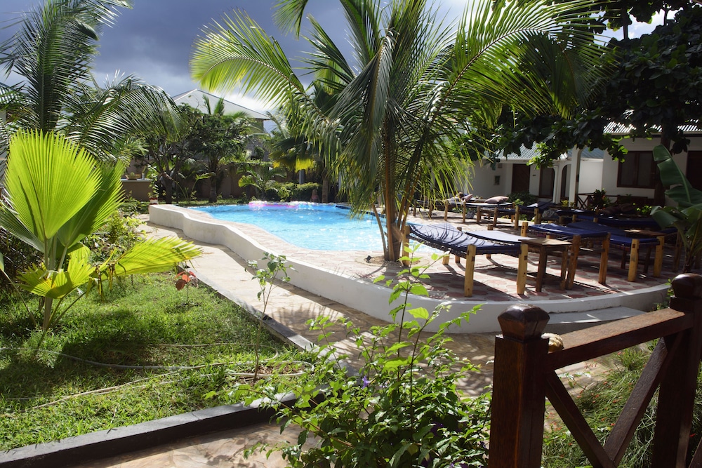 Enjoy recreational amenities such as an outdoor pool and bicycles to rent. Additional amenities at this guesthouse include complimentary wireless internet access, tour/ticket assistance, and barbecue grills. Make yourself at home in one of the 14 individually decorated guestrooms. Rooms have private balconies. Complimentary wireless internet access is available to keep you connected. Bathrooms with showers are provided.